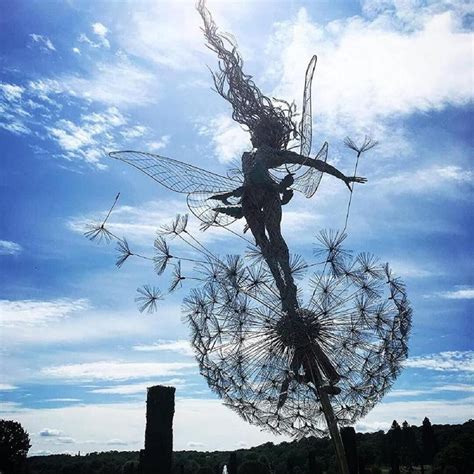 metal garden fairies with dandelions